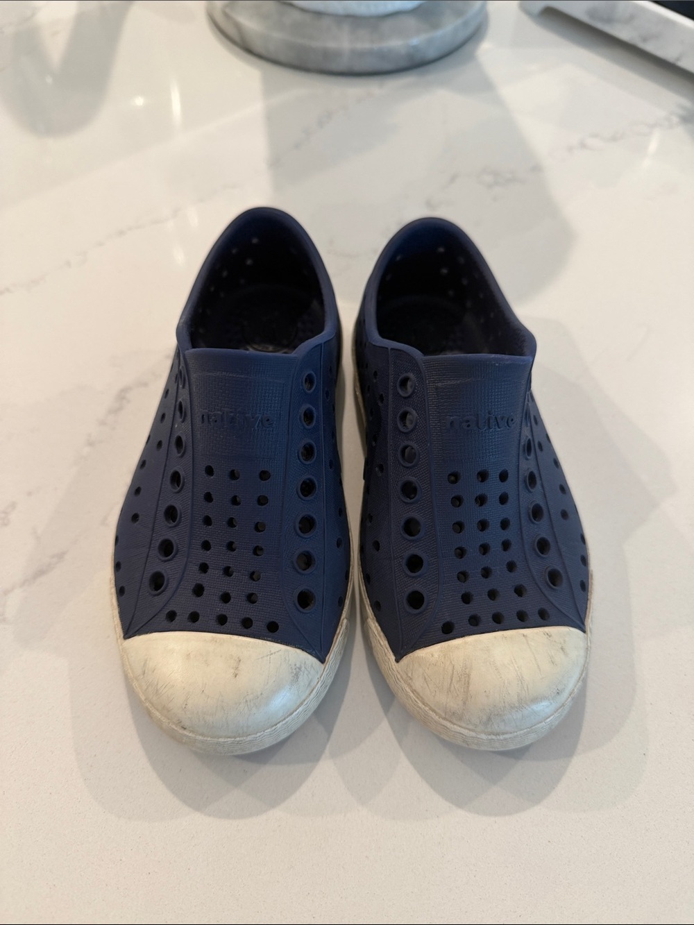 Native Navy Slip-On Sneakers with White Toe Caps
